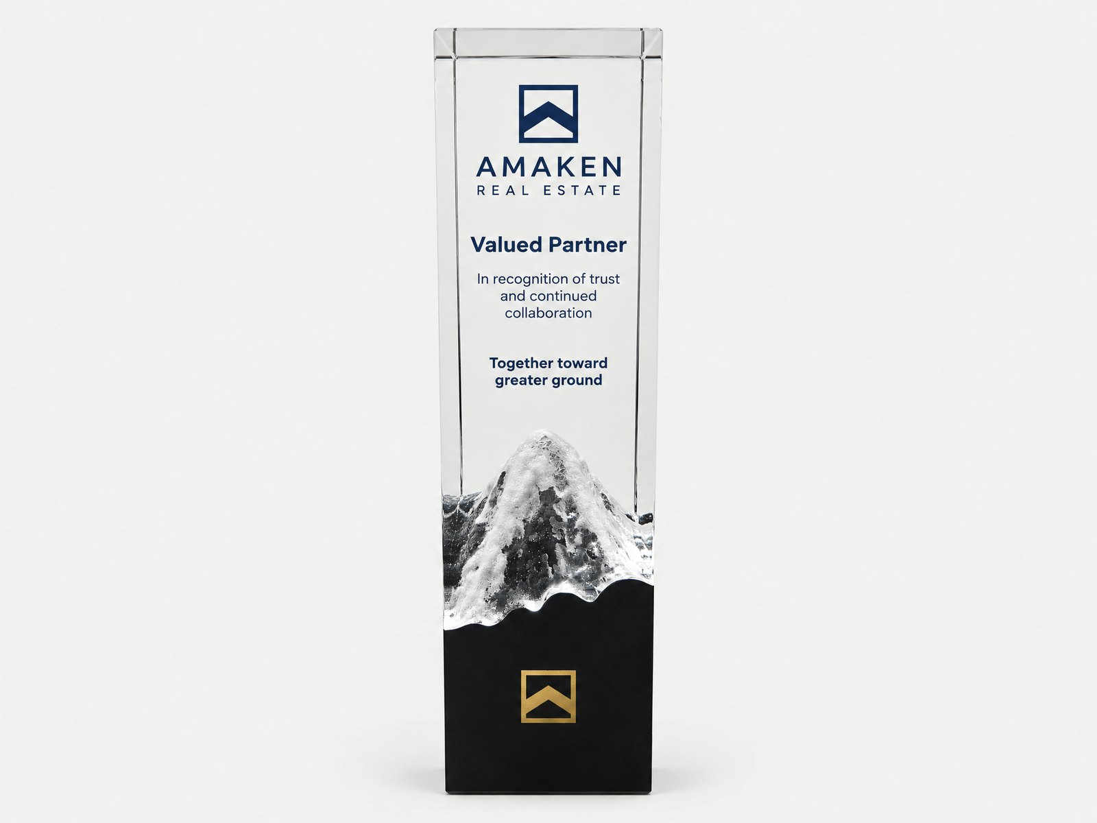 A tall crystal tower with a sculpted frosted peak on a black base.