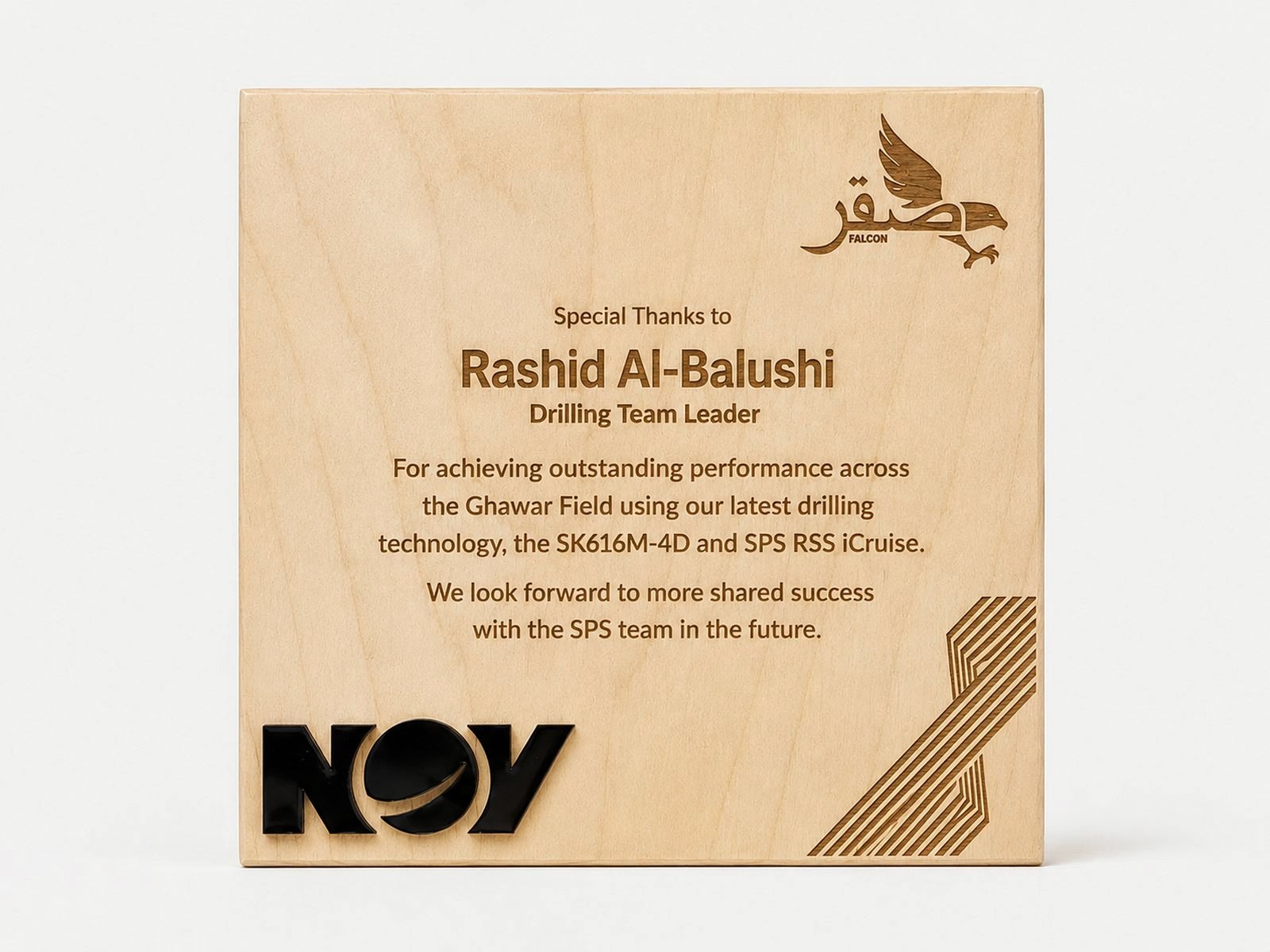 A flat square wood plaque printed with a message and logo.