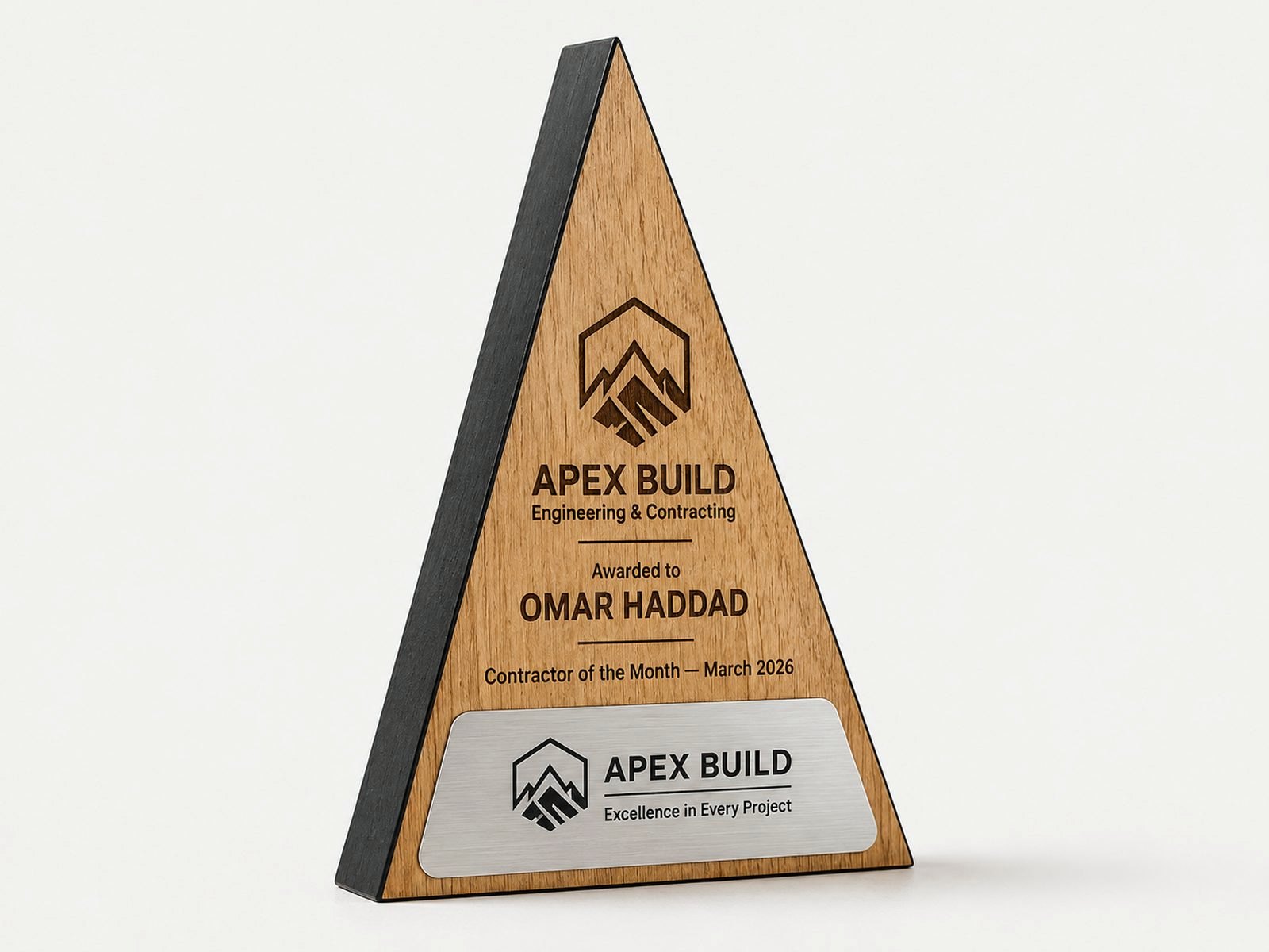 A triangular wood award with brushed metal plates.